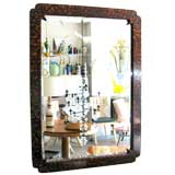 Giltwood faux tortoise shell mirror with beveled glass.