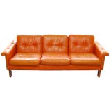 orange leather sofa and matching chair