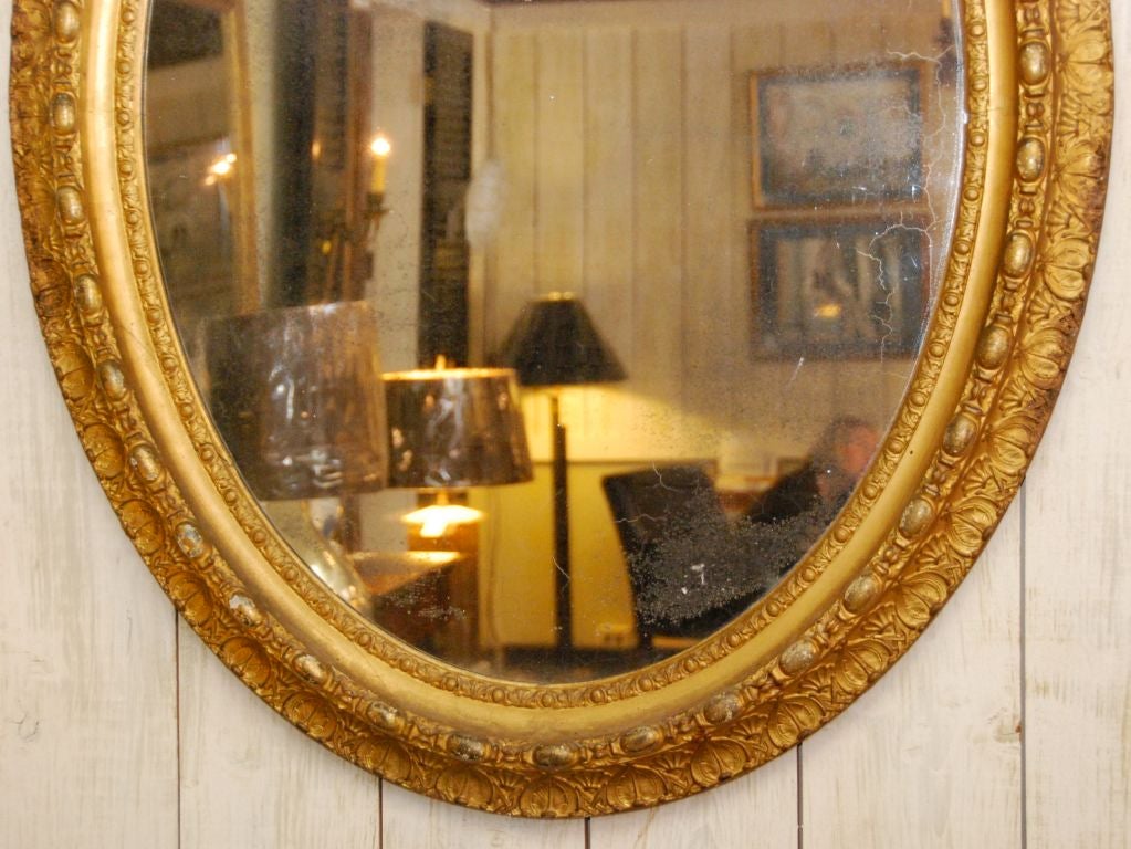 French gilded relief mirror