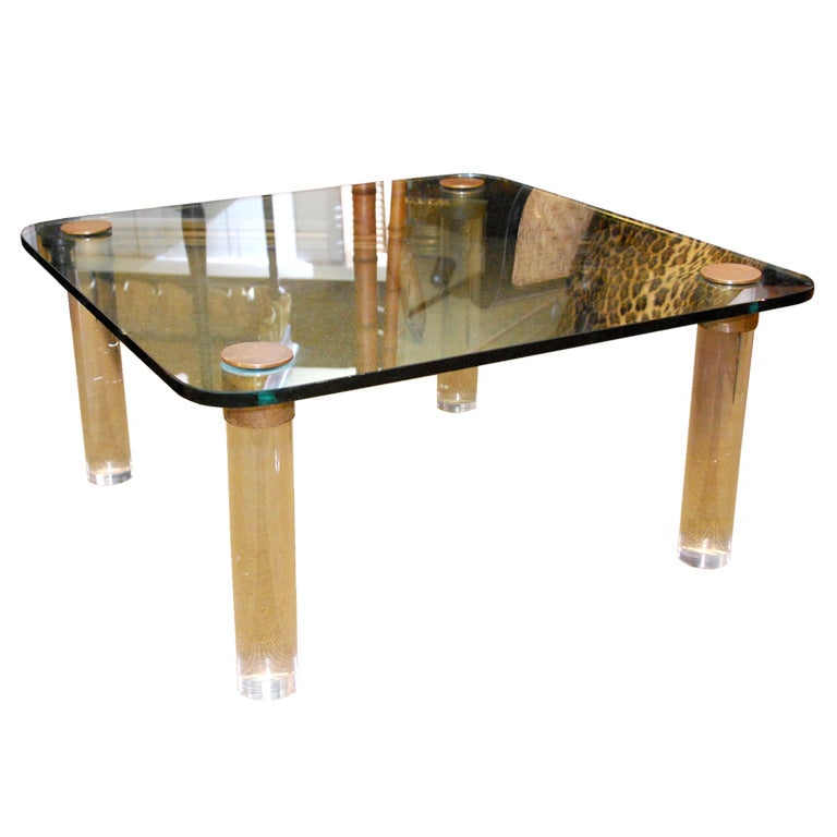 Glass top coffee table with lucite legs