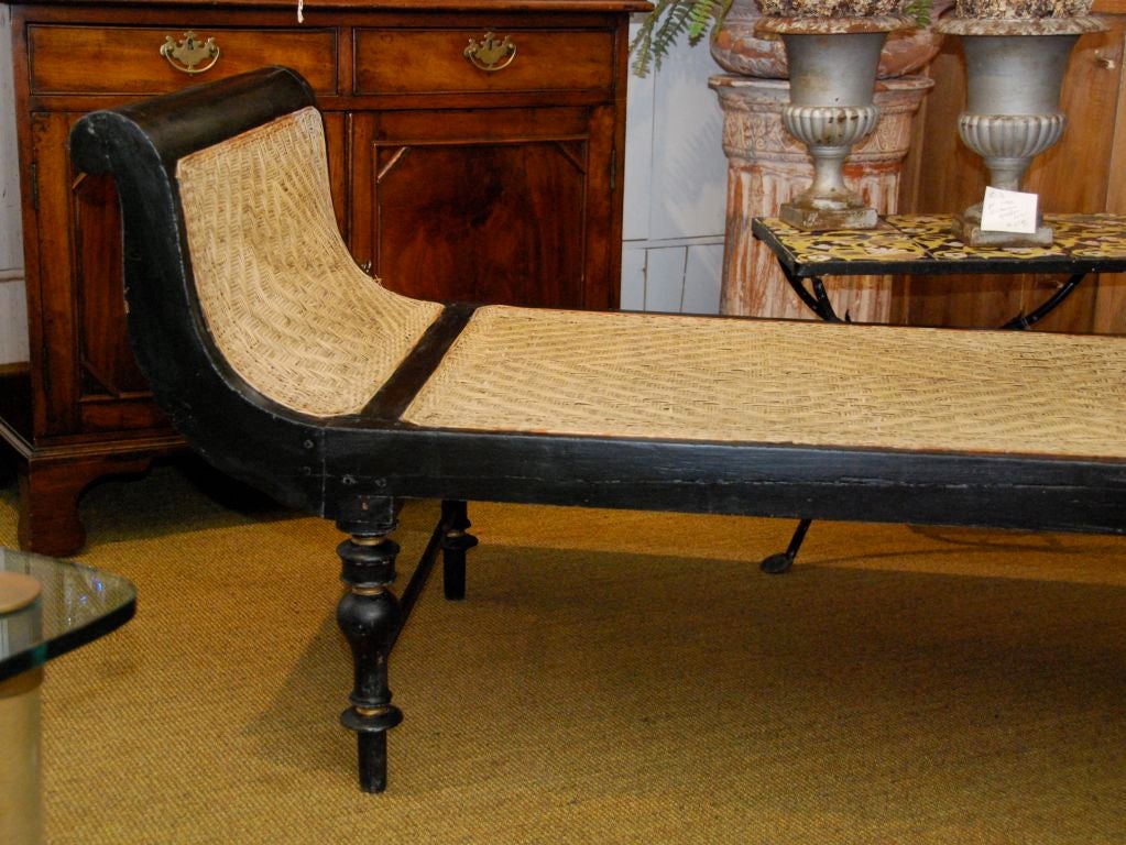 Caned daybed with gold detail