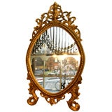 French oval gilded mirror