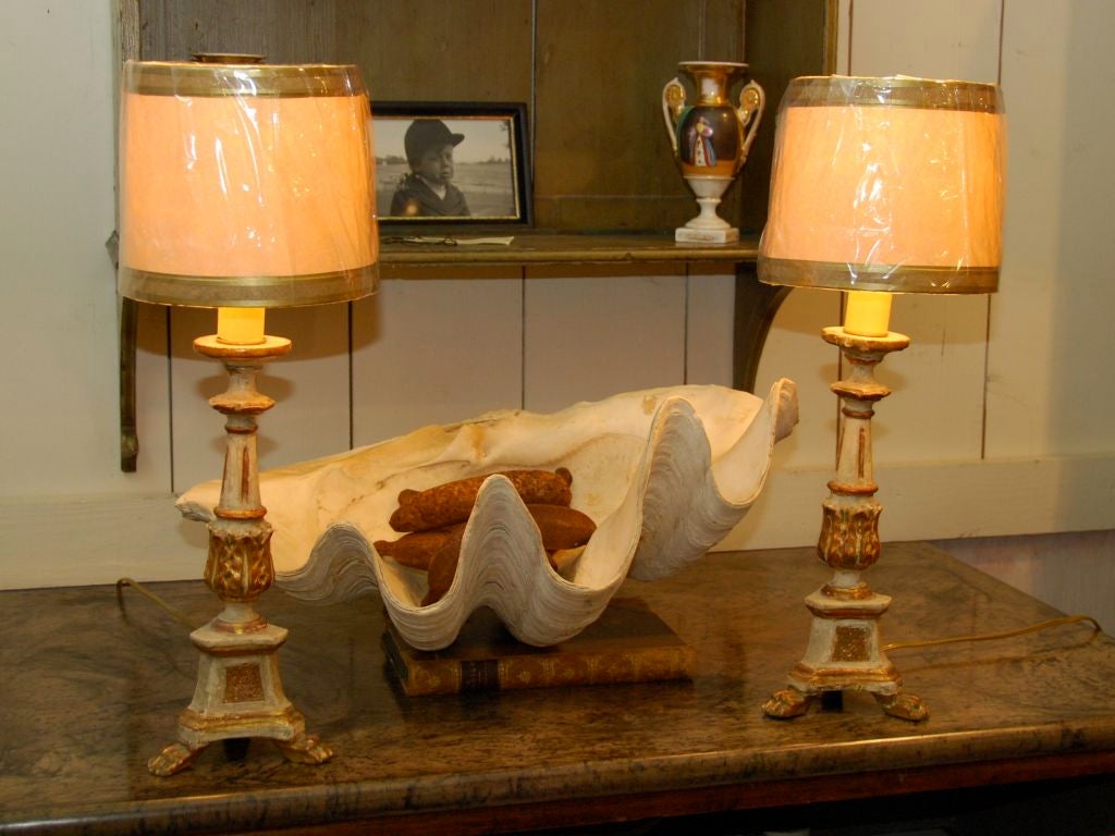 Pair of painted and gilded diminutive pricket lamps