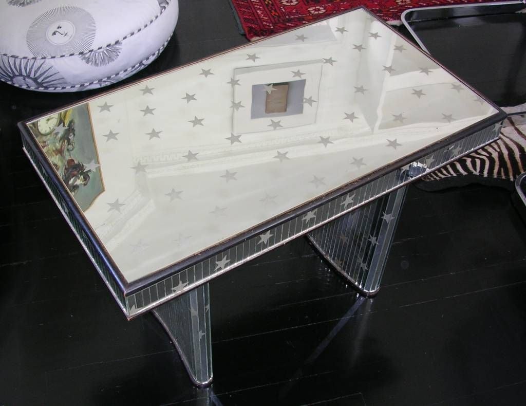 An Art Deco mirrored table with etched stars thoughout. Some wear and tear as described in the condition report but it adds to the vintage charm of the piece. Would be great as a small coffee table or a side table. Price reduced from $2,500.