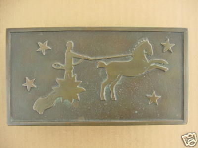 Three Bronze Boxes by E. Dragsted, Denmark. The collection consists of a cigar/cigarette box and two matching match holders. The main design is a charioteer in a sun shaped chariot -- an old Danish belief which represents the sun being pulled across