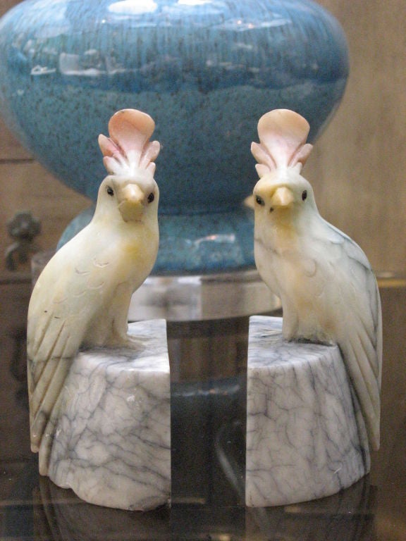 The beautiful marbling in this pair of alabaster bird bookends adds to their distinguished and charming aesthetic.  They would add a quiet playfulness to any room.
