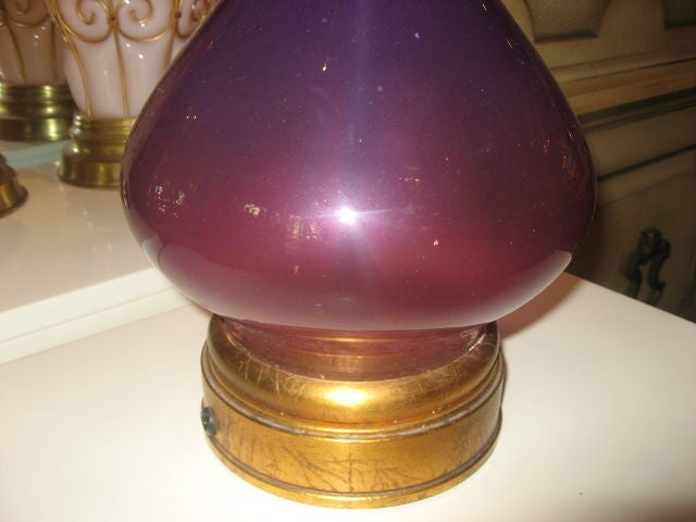 Beautifully colored amethyst glass table lamp with gold leaf detail.