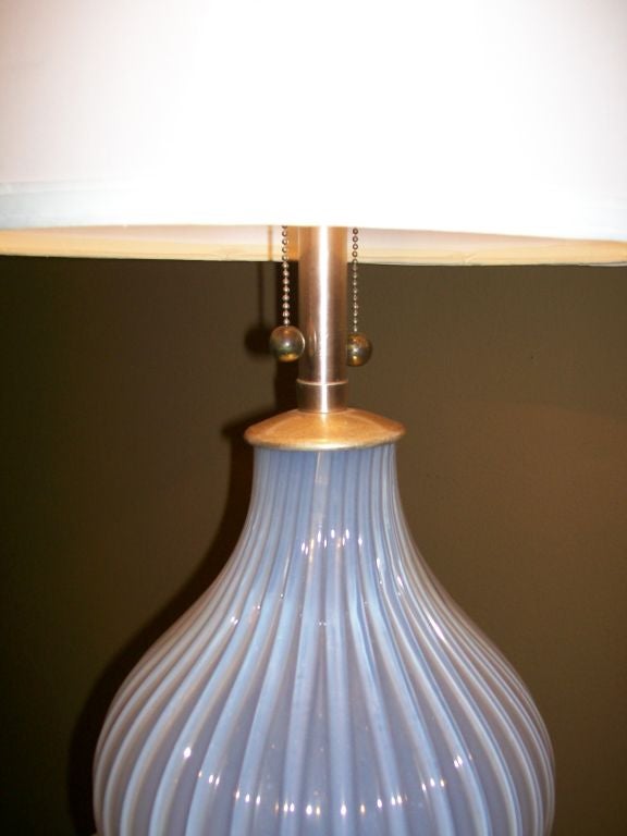 This tall and elegant Murano glass lamp has soft lilac tones that delve in to white or silver depending on the light around it. The shade is not included.