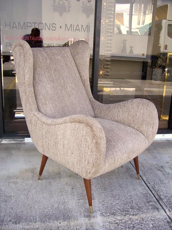 These classically Italian designed chairs feature scalloped edge wingback and armrests. Very organic and ultra elegant!