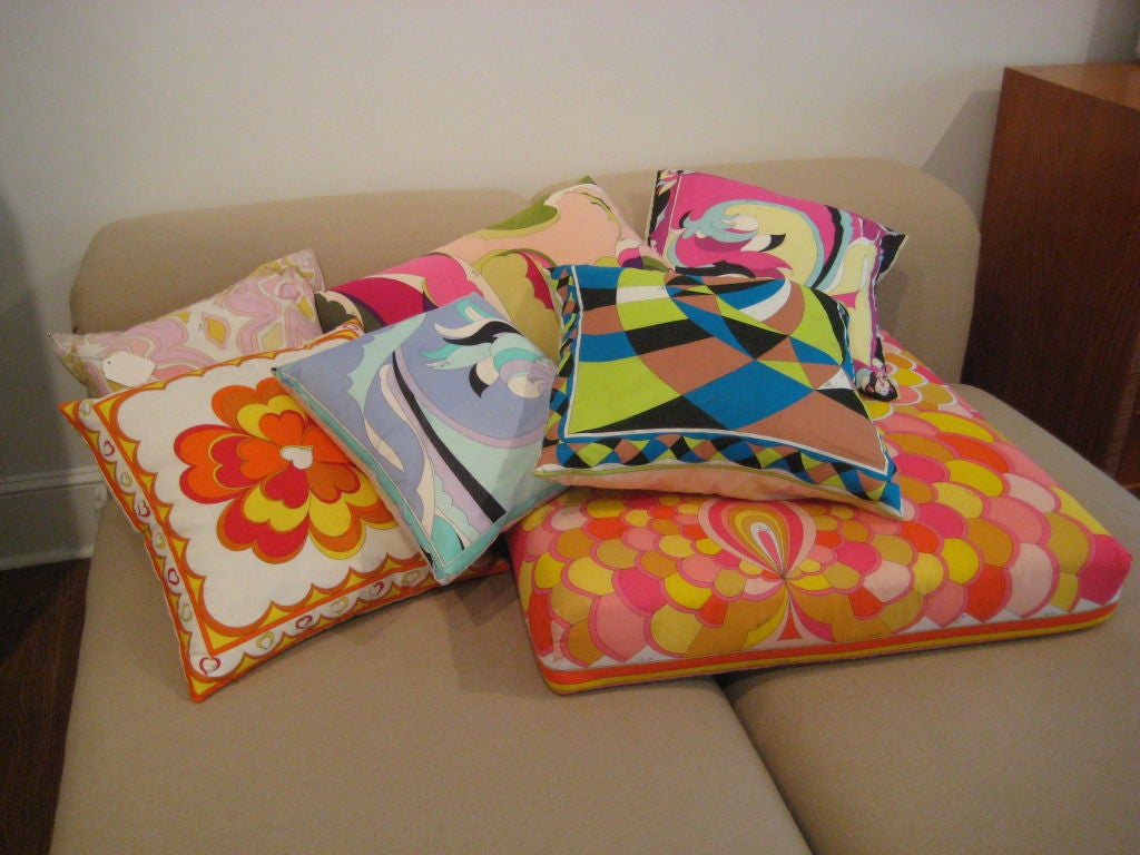 Seven pillows by Emillio Pucci of various sizes.