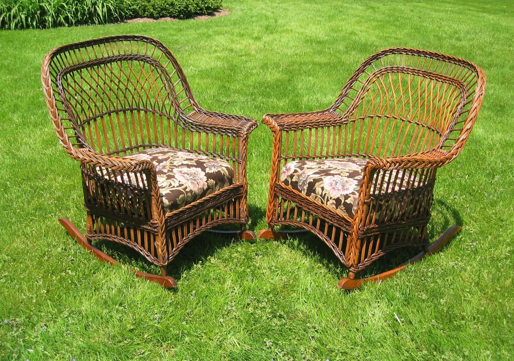 Matching pair of Bar Harbor wicker rocking chairs in original two-toned natural finish with nice even wear.  Combination of traditional Bar Harbor criss-crossed latticing with variation of paired vertical reeding characteristic of the Stick Wicker