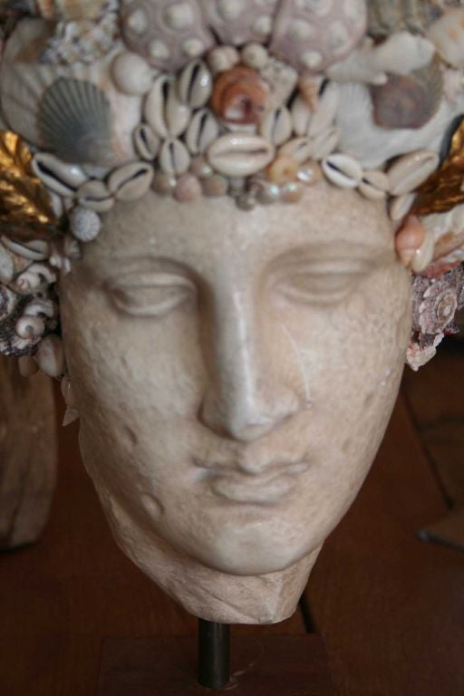 A tribute to the ocean is reflected in this classical vintage plaster bust adorned with seashells and coral.