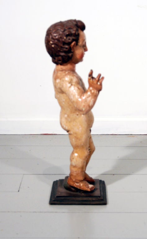 An Italian Polychromed Statue of a Putto