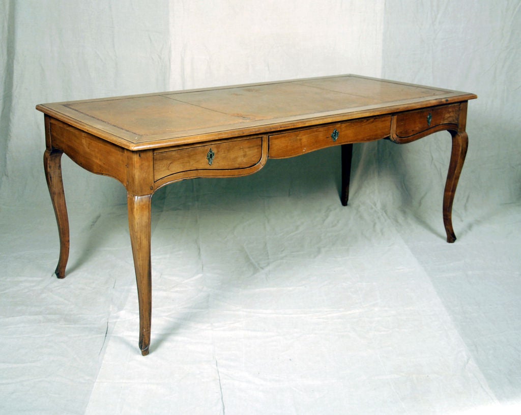 An Art Nouveau Fruitwood Bureau Plat