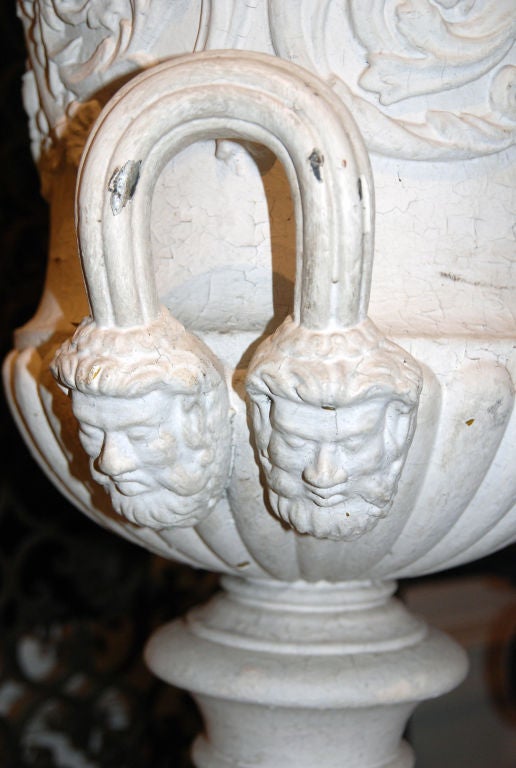 A Pair of George III Style Cast-Iron Urns on Stands