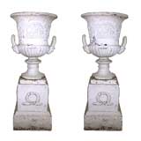 A Pair of George III Style Cast-Iron Urns on Stands