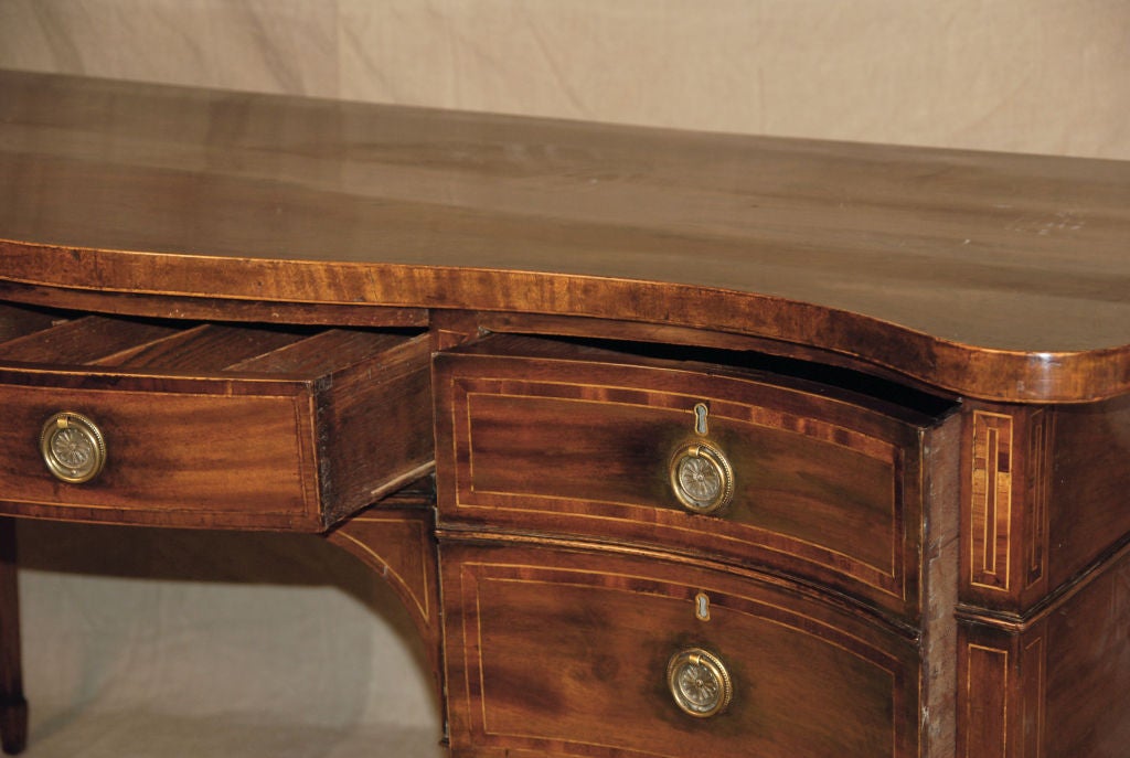 A George III Inlaid Mahogany Serpentine-Fronted Sideboard