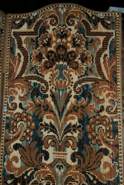 Each arched panel covered in fabric woven in shades of brown, off-white and blue incorporating stylized foliage and strapwork

Height 89 1/4 in. Width of each panel 21 1/4 in.

PROVENANCE

Galerie Camoin, Paris

Acquired from the above,