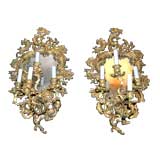 A Pair of Mirrored Four Arm Bronze Sconces