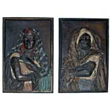 A Pair of Bronze Polychrome Relief Panels of a Man and a Woman