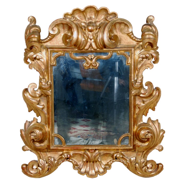 An Important Italian Baroque Giltwood Mirror