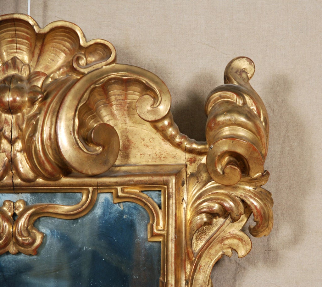 An Important Italian Baroque Giltwood Mirror 1