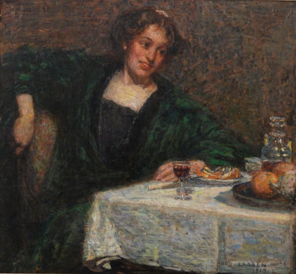 Hugo Larson <br />
Danish, 1875-1950 <br />
 <br />
“At the Table” <br />
 <br />
Oil on canvas <br />
Signed and dated 1913 <br />
26 ½ by 28 ½ in. W/frame 34 by 36 in. <br />
 <br />
 <br />
      Hugo Larson exhibited in Copenhagen from