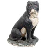 A Cast Stone Statue of a Sitting Dog