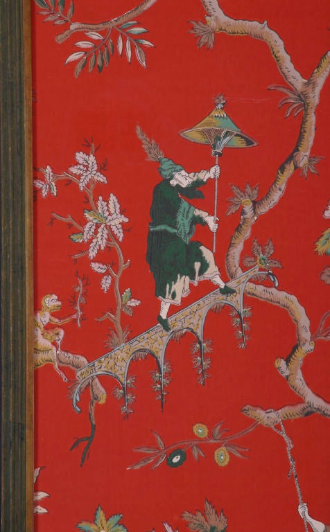 Pair of French hand-painted wallpaper panels of chinoiserie flowers and figures; one on a swing, one jumping rope and one holding a parasol intertwined in the branches of a tree on a red background. The quadruple stepped-back frame is hand-painted