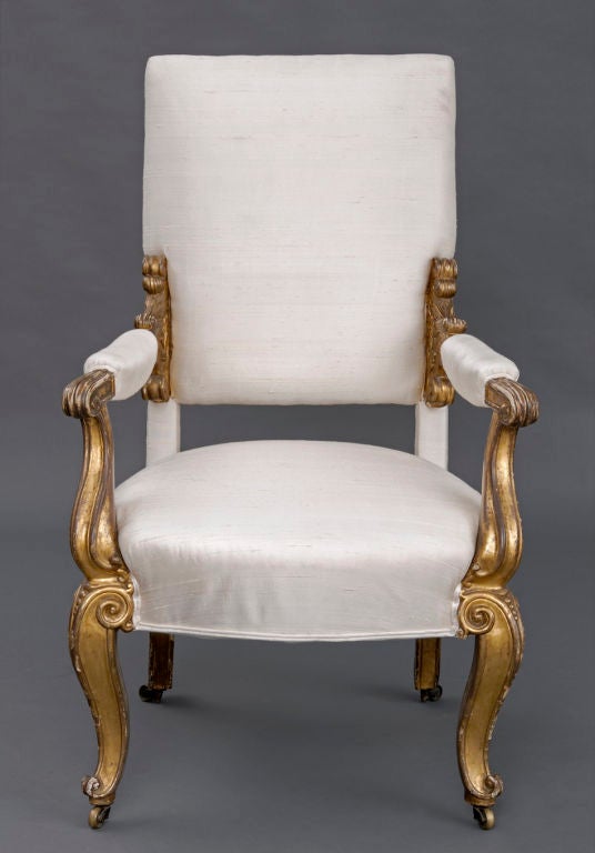 Regency giltwood open armchair with padded high back, scrolled and carved arm supports, padded arm rests, elegant scrolled 