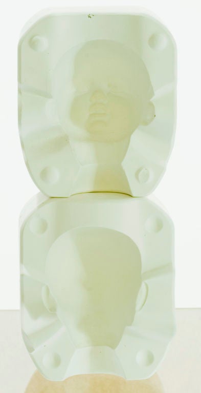 A Baby Bell plastercast mold in four sets of two. Each set casts a different body part--- head, arms, torso and legs. 
