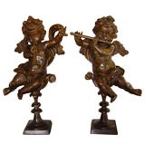 Pair of Patinated Bronze Putti with Musical Instruments
