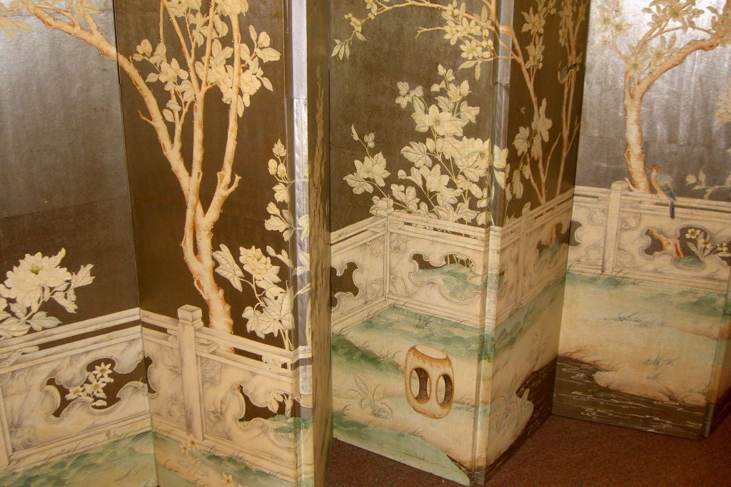 A fabulous Japanese themed hand painted Silver Leaf screen. It is made of Gracie hand painted wallpaper on wood.  The Gracie company has been in business since 1898 in New York City. It has wonderful depictions of birds and even a wasp's nest. The