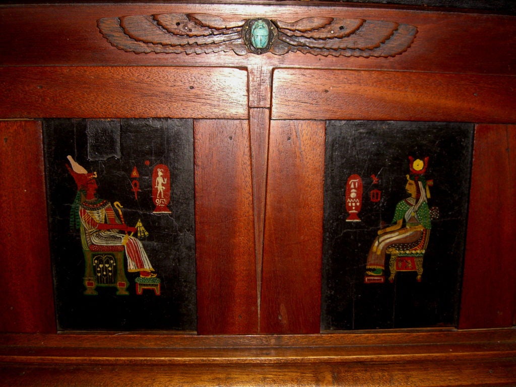 An incredible 19th century English or French Egyptian revival liquor or jewelry casket. It features hand painted scenes all around, four hand painted columns and an agate top. The lock has long been removed. It would have helped identify the piece