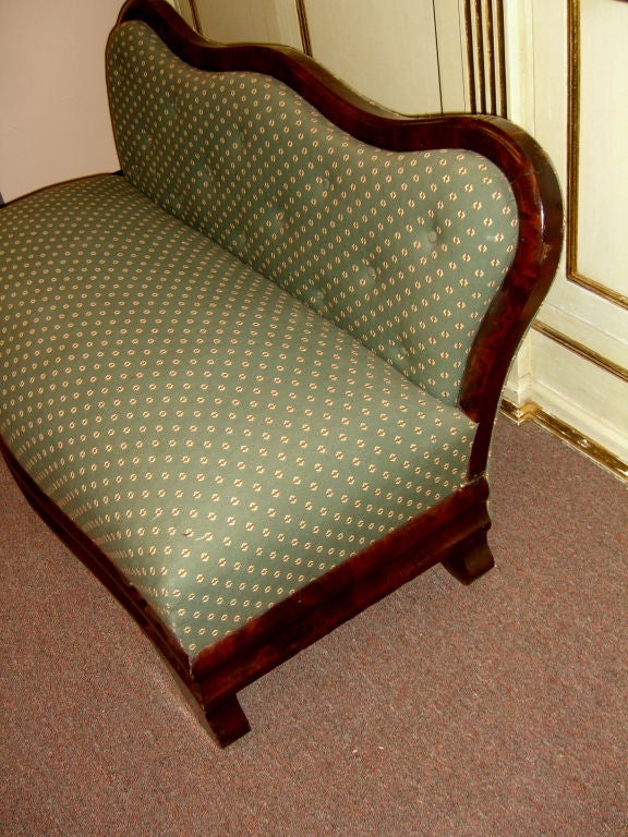 A nice Petite Empire period settee, that has been re-upholstered. It is in very good condition with some scuff marks to one shoulder   and one corner.