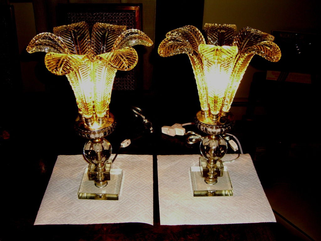 A great pair of Glass Fern leaf Hollywood Regency lamps with glass bases. These lamps have been competely cleaned and totally re-wired. The switch on the body is not functioning and has been replaced by on/off switches on the new cords. The glass