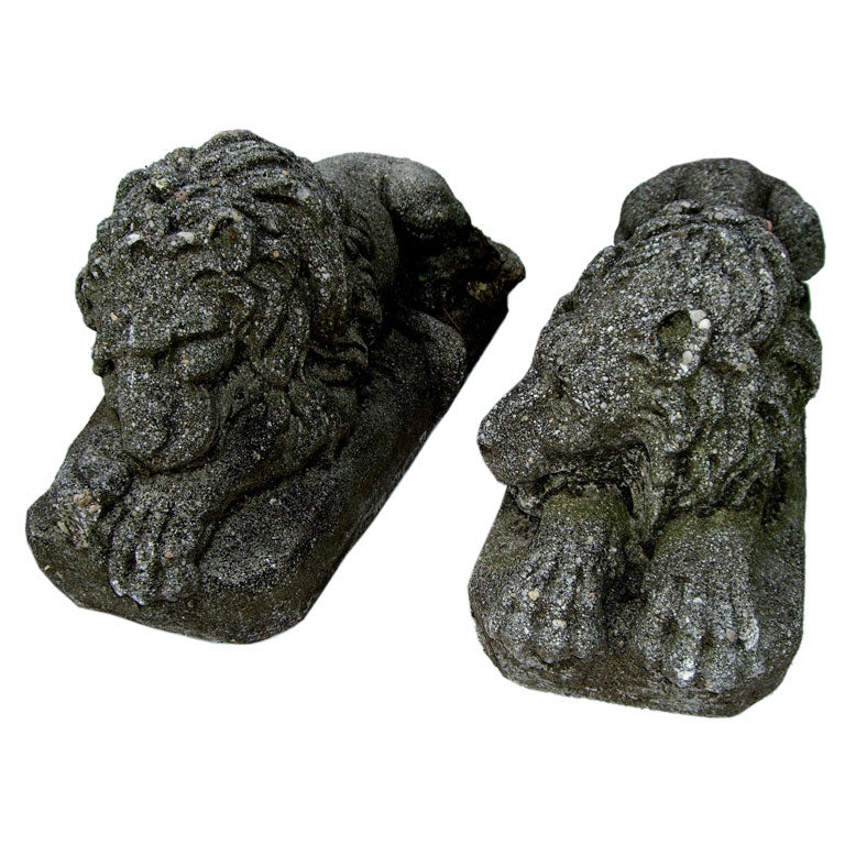 Great pair of of old cast stone recumbent lions