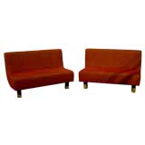 Pair of mid century modern settees with maple legs