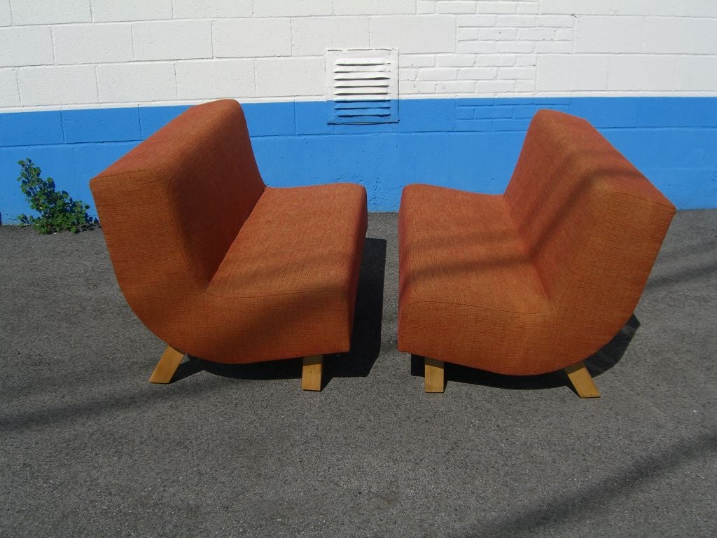 Pair of mid century modern settees with maple legs