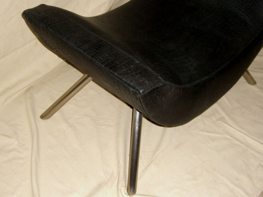 A great looking sculptural curved stool or bench which we had recovered in a crocodile embossed Edelman leather. The stool/bench is comfortable as it is good looking. It will free stand in a room as a piece of sculpture or seating.