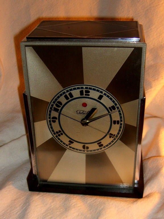 An extremely rare version of a highly sought after art deco classic is this Modernique clock. Designed initially in 1927 for the Warren Telechron Company by Paul Frankl. At a time when most electric clocks sold for $5-7.00 this clock retailed for