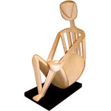 Unusual and whimsical carved oak sculpture of a seated man