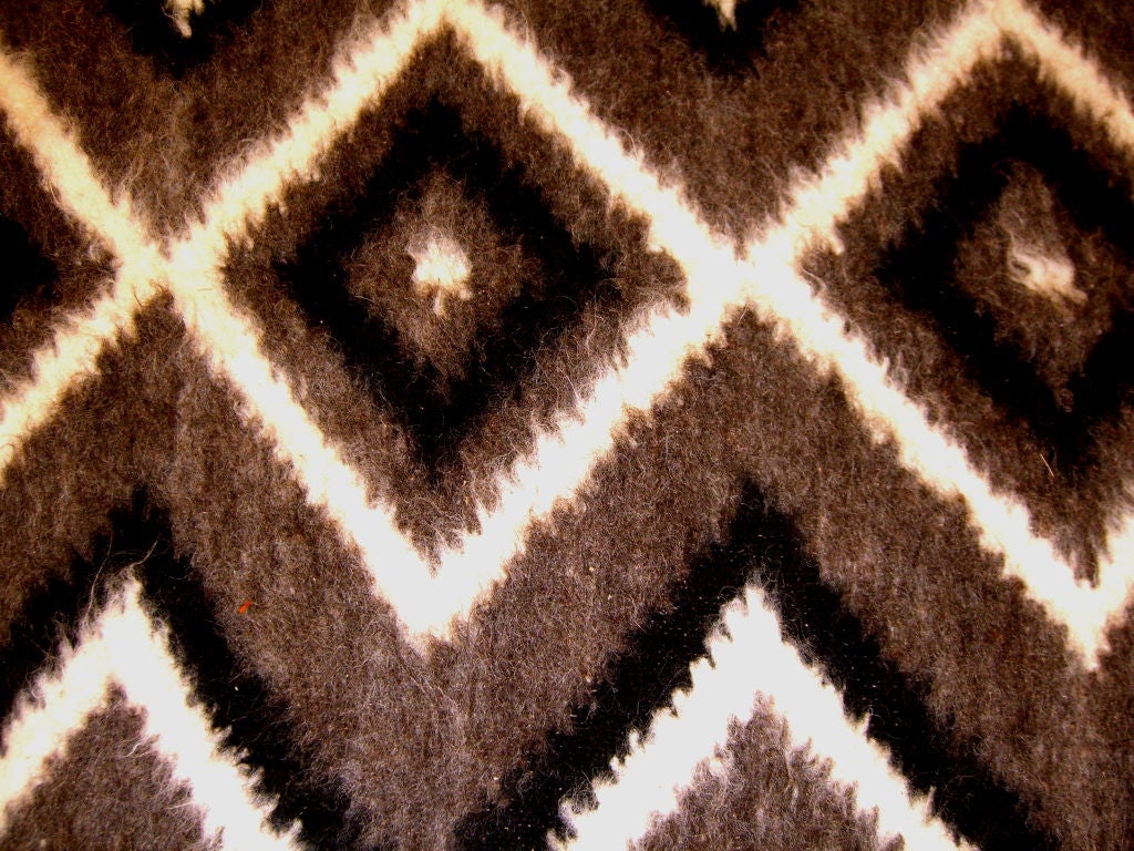 A beautiful hand woven Geometric wall hanging or rug made of Alpaca we believe. It is from the same estate as the probber sofa nd robsjohn gibbings coffee table we recently purchased. It is in excellent condition and is identical on both sides.