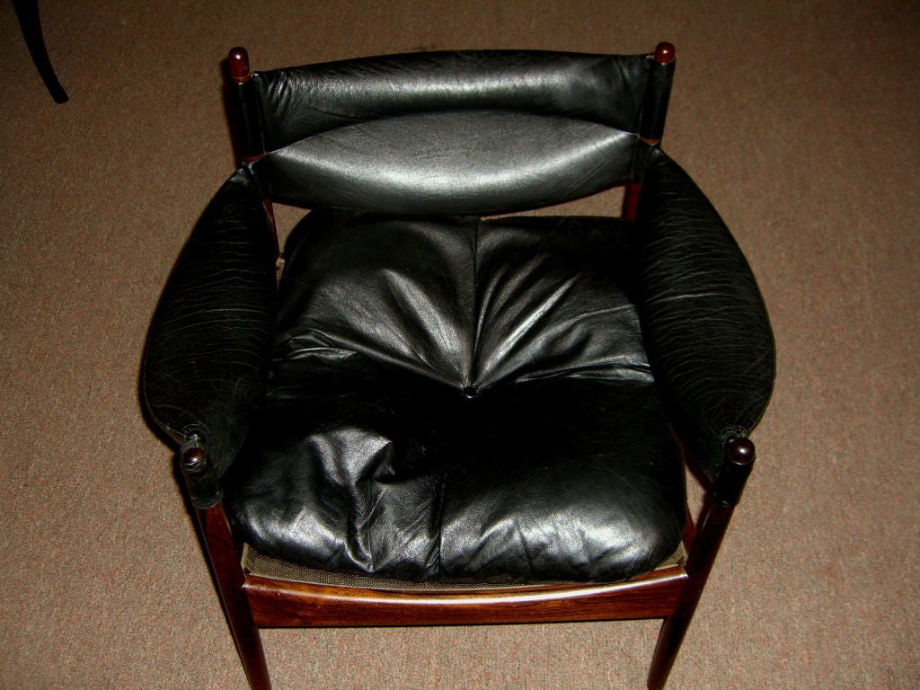 A nicely designed chair and reversible table designed by Kristian Solmer Vedel for the Soren Willadsens company which also produced some Finn Juhl designs. The balck leather is original and has some wear spots but id in generally very good