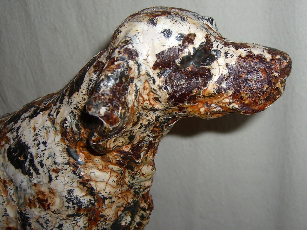 A great old cast iron boot scraper with a hunting dog on top which looks like an Irish Setter or some sort of pointer. There is quite a bit of paint loss, but we cleaned it up and sprayed it with matte lacquer so that it won't rust any further, and