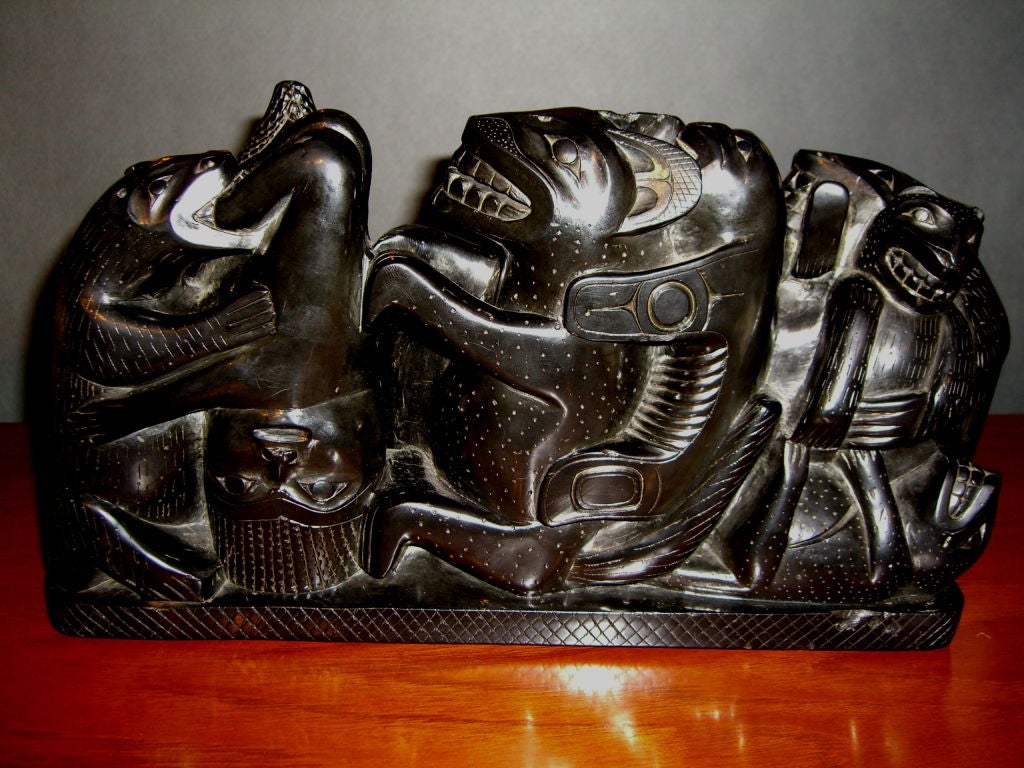 An extremely rare and large Haida figural Argillite carving with a label on the bottom which is barely readable but is dated Autumn of 1898. The label features references to the myth that this figural carving represents. It is likely the myth that