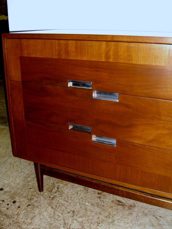 Walnut American of Martinsville cabinet with caned door aluminum inlay