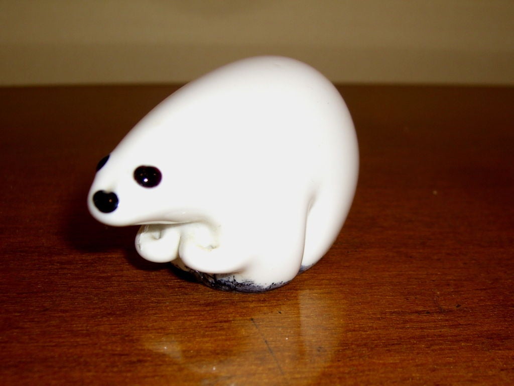 3 adorable white cased glass polar bears, probably a family with a Papa bear a Mama bear and a baby. They are most likely Scandinavian and are of very high quality. The largest bear is approx 3x5 inches the smallest is 3x2 inches.