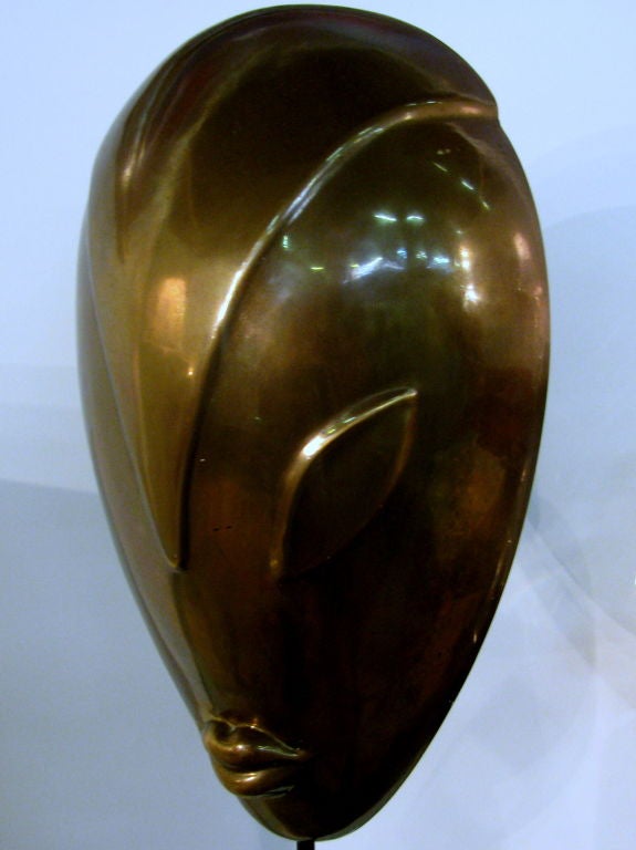 Hagenauer styled hand hammered brass mask on bronze stand
