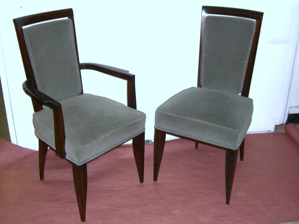 A really wonderful and hard to find set of ten 1930's period  matching dining chairs from France. They are faux painted to look like kingwood and re-upholstered in wool gray mohair. We had them redone, but we left the original paint which means